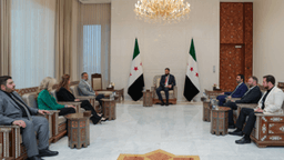الشرع مع كوري لي ميلز.jpg
